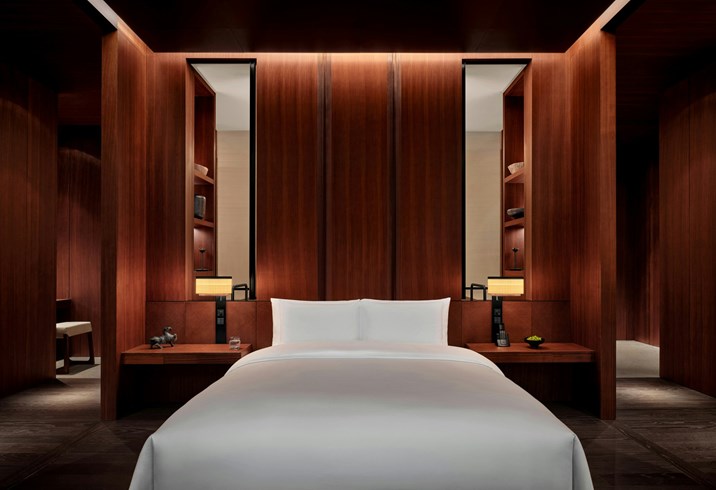 Suite bedroom at Lohkah Hotel & Spa with timber panelling