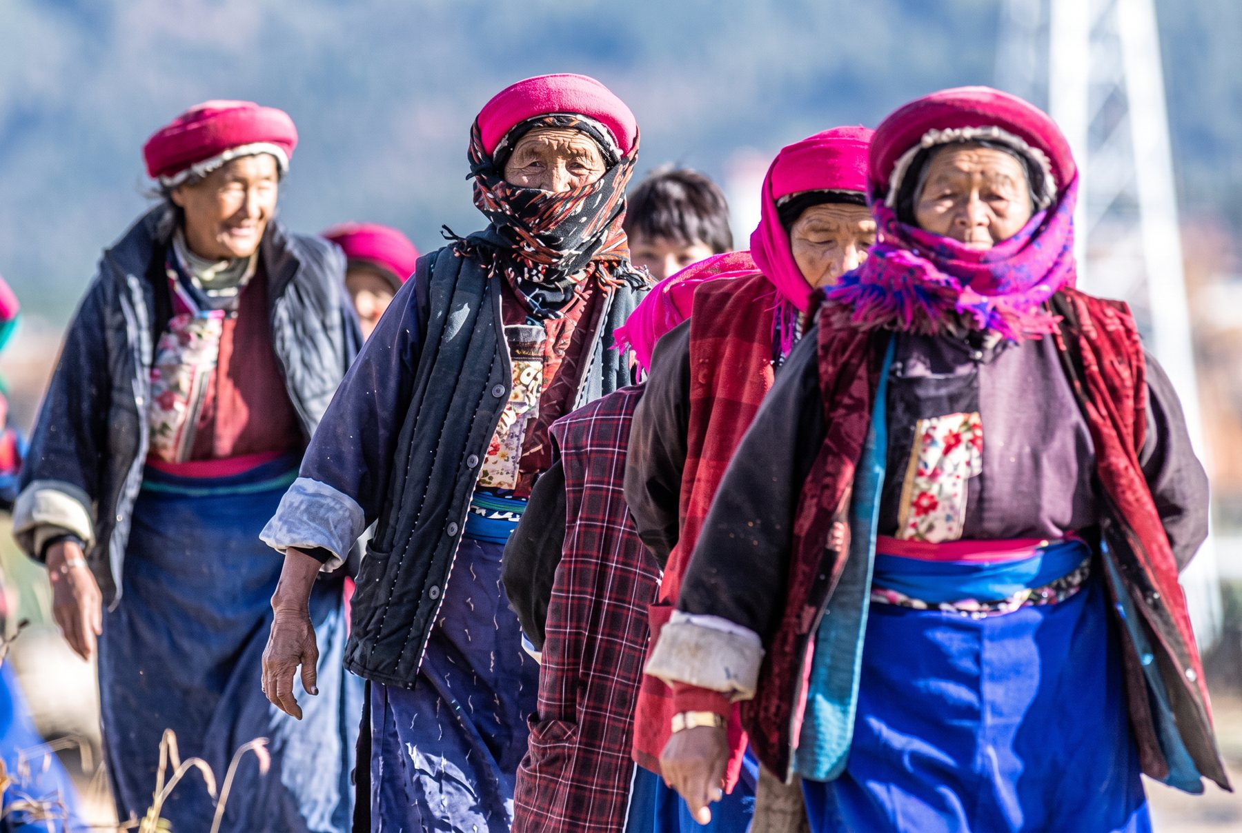 Tibetan elders in traditional dress near Benzilan