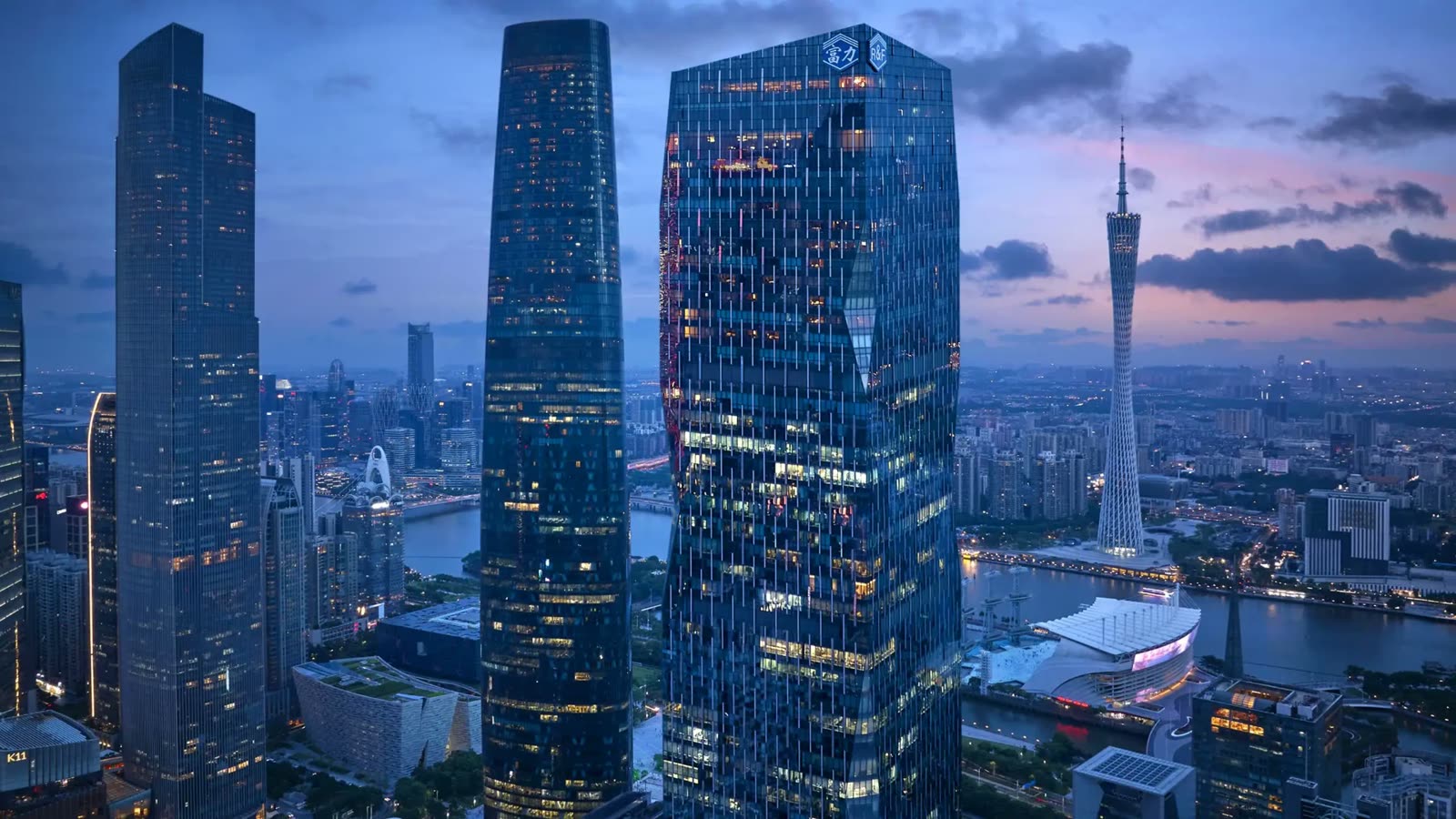 Park Hyatt Guangzhou tower above Zhujiang New Town at dusk