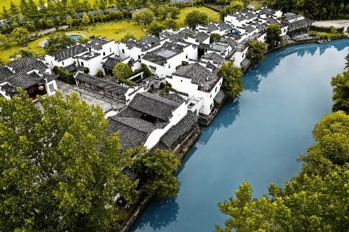 Aerial view of Marvel Land Boutique Hotel beside the water at Xiuli village