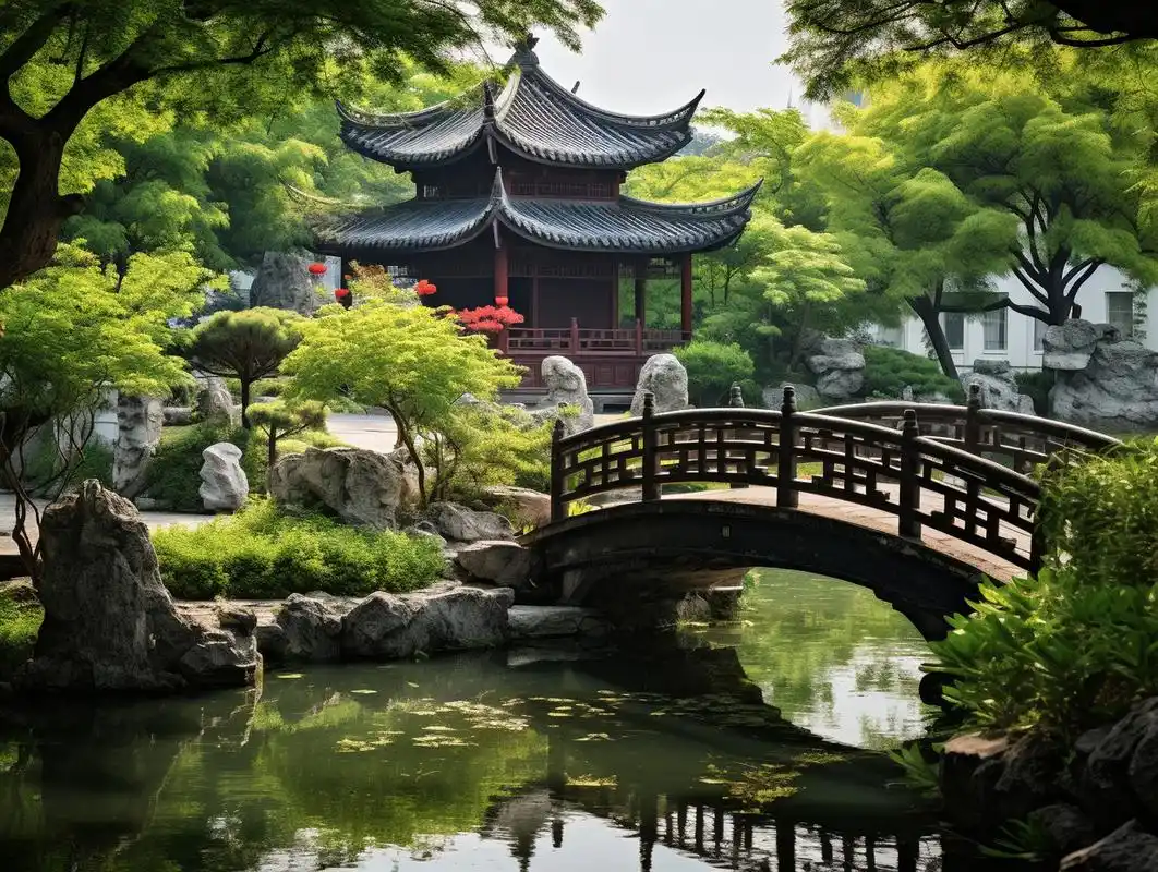 A classical Suzhou garden with a pavilion and arched bridge over still water