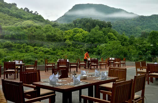 Open-air dining terrace facing the forested slopes of Mount Emei