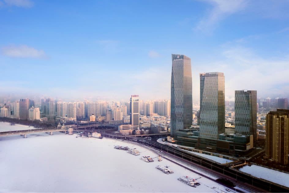 The Ritz-Carlton, Harbin towers above the frozen Songhua River